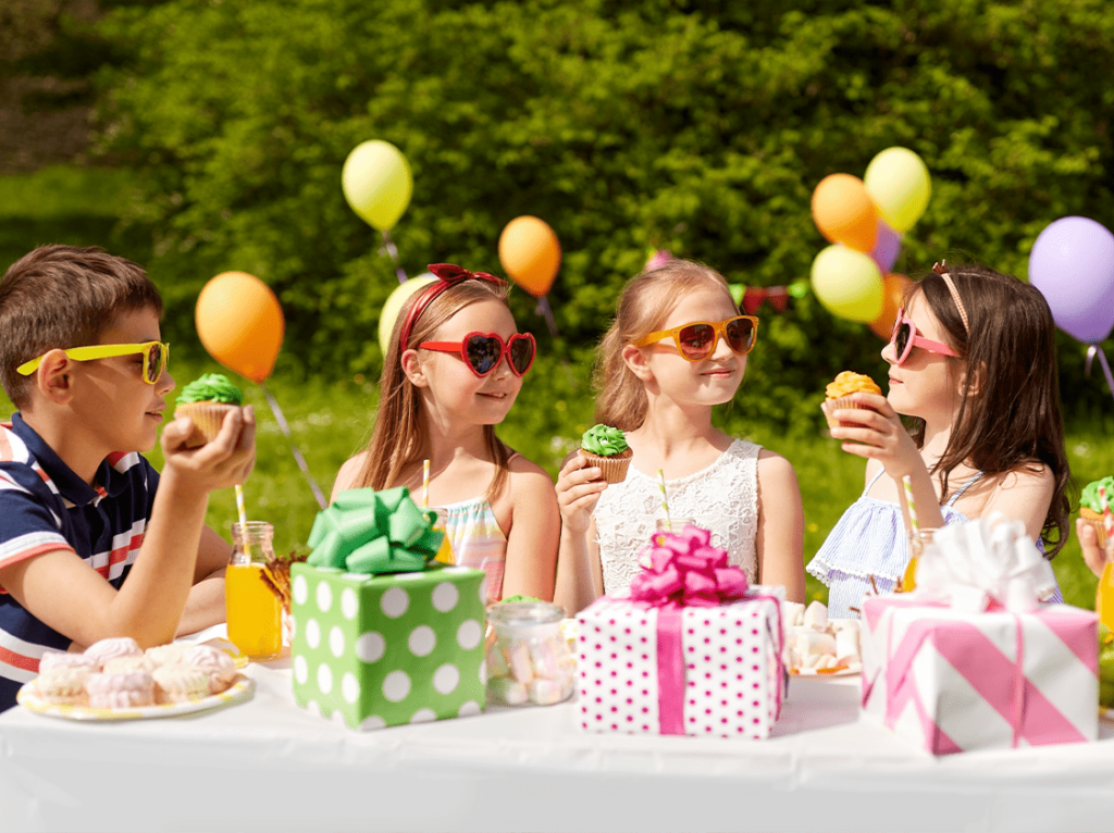 A vibrant and joyful kids' birthday party setup featuring colorful decorations, balloons, and a lively celebration atmosphere.